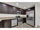 Modern kitchen with stainless steel appliances and pantry at 8960 Fox Season Ave, Las Vegas, NV 89178