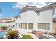 Large backyard with a pool, spa, and outdoor kitchen at 9123 Claretta Dr, Las Vegas, NV 89129