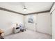 Bedroom with window, chair, and ceiling fan at 9123 Claretta Dr, Las Vegas, NV 89129