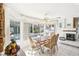 Breakfast nook with pool view and ornate chairs at 9123 Claretta Dr, Las Vegas, NV 89129