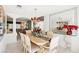 Bright dining room with chandelier and view into living room at 9123 Claretta Dr, Las Vegas, NV 89129