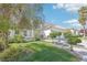 Two-story house with a three-car garage and well-manicured lawn at 9123 Claretta Dr, Las Vegas, NV 89129