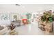 Bright and airy living room with an orange chair and artwork at 9123 Claretta Dr, Las Vegas, NV 89129