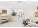 Elegant living room with a white sofa and view of a staircase at 9123 Claretta Dr, Las Vegas, NV 89129