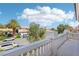 Balcony view of a residential street with houses and palm trees at 9123 Claretta Dr, Las Vegas, NV 89129