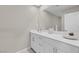 Bathroom with single vanity, white cabinets, and a large mirror at 9289 Casa Sierra Ln, Las Vegas, NV 89148