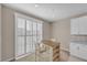 Small dining area with a table and chairs near sliding doors at 9289 Casa Sierra Ln, Las Vegas, NV 89148