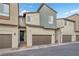 Contemporary townhome featuring two-car garage and sleek design at 9289 Casa Sierra Ln, Las Vegas, NV 89148