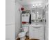 Clean bathroom with white vanity, subway tile, and storage at 10009 Delicate Dew St, Las Vegas, NV 89183