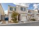 Two-story house with attached garage and landscaping at 10009 Delicate Dew St, Las Vegas, NV 89183