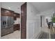 Modern kitchen with dark cabinetry and stainless steel appliances at 10009 Delicate Dew St, Las Vegas, NV 89183