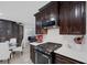 Modern kitchen with stainless steel appliances and white backsplash at 10009 Delicate Dew St, Las Vegas, NV 89183