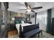 Spacious main bedroom with dark wood furniture and ceiling fan at 10009 Delicate Dew St, Las Vegas, NV 89183