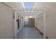 Backyard patio features a pergola and gray concrete flooring at 10009 Delicate Dew St, Las Vegas, NV 89183