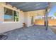 Covered patio with ceiling fan and pavers at 1004 Huckburn Ave, Henderson, NV 89015