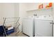 Laundry room with washer, dryer, and drying rack at 1004 Huckburn Ave, Henderson, NV 89015