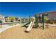 Community playground with playset and wood-chip surface at 1004 Huckburn Ave, Henderson, NV 89015