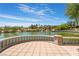 Stunning lake view with a beautiful stone patio at 10452 Acclamato Ave, Las Vegas, NV 89135