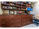 Home office with ample storage and built-in shelving at 10452 Acclamato Ave, Las Vegas, NV 89135