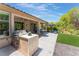 Built-in outdoor kitchen with grill and ample counter space at 10452 Acclamato Ave, Las Vegas, NV 89135