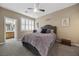 Cozy bedroom featuring plush bedding, neutral tones, and bright natural light at 1067 Via Saint Andrea Pl, Henderson, NV 89011