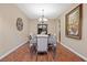 Formal dining room featuring hardwood floors, stylish furnishings, and elegant decor at 1067 Via Saint Andrea Pl, Henderson, NV 89011