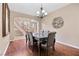 Elegant dining room with hardwood floors, a chandelier, and seating for six at 1067 Via Saint Andrea Pl, Henderson, NV 89011