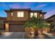 Charming two-story home with a desert landscape and an attached two-car garage at 1067 Via Saint Andrea Pl, Henderson, NV 89011