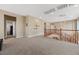 Bright hallway with stylish chandelier leading to bedroom doors, offering ample space and natural light at 1067 Via Saint Andrea Pl, Henderson, NV 89011