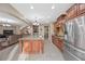 Open-concept kitchen featuring a center island, stainless appliances, and ample cabinet space at 1067 Via Saint Andrea Pl, Henderson, NV 89011