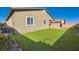 Backyard featuring artificial turf at 10923 Stone Crossing Ave, Las Vegas, NV 89166