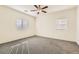 Neutral bedroom with standard ceiling fan and carpet at 10923 Stone Crossing Ave, Las Vegas, NV 89166