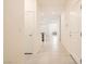 Hallway with tile flooring and white doors leading to other rooms at 10923 Stone Crossing Ave, Las Vegas, NV 89166