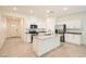 Bright kitchen featuring a center island, granite countertops, and stainless steel appliances at 10923 Stone Crossing Ave, Las Vegas, NV 89166