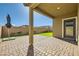 Covered patio with brick pavers, perfect for outdoor entertaining and relaxation at 10923 Stone Crossing Ave, Las Vegas, NV 89166