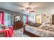 Main bedroom with large bed, dresser and ceiling fan at 1144 Sage Valley Ct, Las Vegas, NV 89110