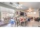 Bright dining room featuring a large table and access to the backyard pool at 1144 Sage Valley Ct, Las Vegas, NV 89110