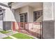 Front entrance with red wrought iron gate and screen door at 1144 Sage Valley Ct, Las Vegas, NV 89110