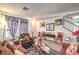 Living room with wood-look floors, neutral walls, and comfortable seating at 1144 Sage Valley Ct, Las Vegas, NV 89110