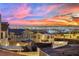 Community overview showcasing homes with city views at sunset at 12073 Glentana View St, Las Vegas, NV 89138