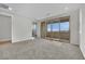 Spacious bedroom with balcony access and carpet flooring at 12073 Glentana View St, Las Vegas, NV 89138