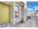 Inviting front entrance with lime green door and landscaping at 12073 Glentana View St, Las Vegas, NV 89138