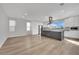 Modern kitchen with island, white cabinets, and hardwood floors at 12073 Glentana View St, Las Vegas, NV 89138