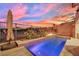 Relaxing pool with a water feature and beautiful sunset view at 12073 Glentana View St, Las Vegas, NV 89138