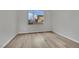 Bright spare bedroom with light gray walls and wood floors at 12073 Glentana View St, Las Vegas, NV 89138