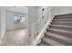 Modern staircase with light wood flooring and metal railing at 12073 Glentana View St, Las Vegas, NV 89138