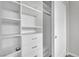 Well-lit walk-in closet with shelves and drawers at 12073 Glentana View St, Las Vegas, NV 89138