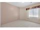 Simple bedroom with tile floors and window with blinds at 1226 Sunfire St, Henderson, NV 89014