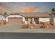 One-story house with a brown garage door and landscaped front yard at 1226 Sunfire St, Henderson, NV 89014