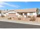 Single story home with attached garage and desert landscaping at 1226 Sunfire St, Henderson, NV 89014